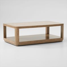 a coffee table with two shelves on each side and one shelf below it that is made out of wood