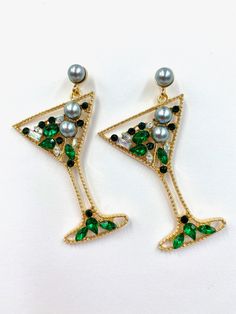 The Misty Martini Earrings are stunning statement earrings, sparkling from top to bottom; these earrings come in champagne gold, Green, and Multi-colour. These are the perfect party, festive, and girls' night out earring that is sure to have everyone asking you about them. Put a smile on your face with these showstoppers! Stud style closure You will receive a spare set of backs for every pair of earrings purchased MOST POPULAR IN STORE 6.2cm x 4.7cm weight 12 g (pair) Gold Rhinestone Jewelry For Parties, Glamorous Sparkling Earrings As Gift, Glamorous Sparkling Earrings For Gift, Elegant Green Crystal Earrings For Festive Occasions, Elegant Holiday Earrings For Festive Occasions, Glamorous Crystal Pearl Earrings For Evening, Elegant Festive Holiday Earrings, Elegant Holiday Festive Earrings, Elegant Christmas Celebration Earrings