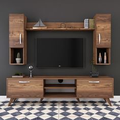 an entertainment center with a flat screen tv mounted on it's side, in front of a gray wall