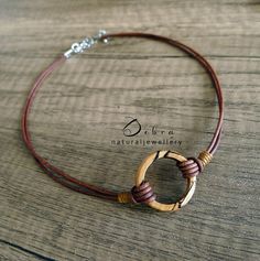 ★DESCRIPTION★ Spalted Beech Wood Circle Infinity/Karma Choker. Pendant Style Also Available (see photo) ★STYLE OPTIONS★ There are 2 styles of necklaces to choose from in drop down menu. Choker style or pendant style (see photos) The choker style also has 2 options, cords together (photo 1) or slightly apart (photo 5 mannequin)  There is a choice of either gemstone or wood. Click on drop down menu box and click on your choice There is a choice of leather or cotton. Click on other drop down menu a Nickel-free Round Earthy Jewelry, Nickel-free Earthy Round Jewelry, Earthy Jewelry As Unique Gift, Unique Brown Jewelry For Everyday, Minimalist Brown Jewelry As A Gift, Minimalist Brown Jewelry For Gift, Minimalist Brown Jewelry As Gift, Rustic Hand Wrapped Jewelry As A Gift, Rustic Hand-wrapped Jewelry Gift