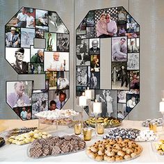 a table topped with lots of food next to a wall covered in pictures and candles