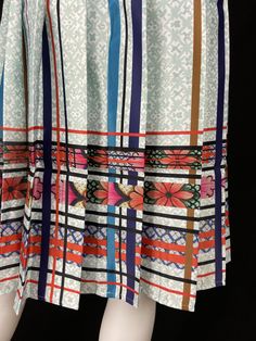 Mexican Fashion Pleated Skirt - Nayibi Mexico Talavera Skirt This elegant skirt is from the Talavera Collection inspired by the tiles of the region of Puebla where they began to make floors made of clay painted by hand taking as reference the Spanish pottery of which the Mexican appropriated this so-called “Talavera”. Lined Backed zipper *Pairs wonderfully with Talavera Top Care/Import Dry clean Import Contents 100% Polyester 100% Polyester Linning White Printed Long Skirt, Multicolor Printed Flared Skirt, Patterned Printed Flowy Skirt, Patterned Long Skirt With Lining, Relaxed Multicolor Lined Pleated Skirt, Long Patterned Lined Skirt, Multicolor Lined Flared Pleated Skirt, Spanish Pottery, Tooled Leather Handbags