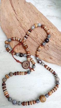 Extra long beautiful beaded strand of recycled African Glass, African Turquoise, Picture Jasper, Aventurine, Agate, shell disks, artisan beads, assorted natural and metal spacer beads, Java beads, coconut, and more. Very unique and earthy. Leather loop and coconut button closure. Necklace is a lovely display of textures and contrast. 30" in length but extendable to 31". The item/s pictured is the item you will receive. HavSolStudio on ETSY | Mixed media . Earthy elegance . Great texture . Beach Adjustable Nature-inspired Beaded Necklace With Natural Stones, Adjustable Natural Stones Beaded Necklace In Nature-inspired Style, Bohemian Jasper Beaded Necklaces Hand-strung, Earthy Agate Beaded Necklaces With Round Beads, Bohemian Hand-strung Jasper Beaded Necklaces, Nature-inspired Beaded Necklaces With Round Natural Stones, Nature-inspired Beaded Necklaces With Natural Stones, Earthy Agate Beaded Necklaces, Hand-strung Nature-inspired Beaded Necklaces