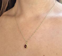 Gold Garnet necklace, 14k gold pendant necklace, January birthstone necklace mom, Red Garnet necklace, January Birthday, Gold Garnet Jewelry This minimalist Garnet necklace was set with a deep red January birthstone pendant, to beautifully accompany you through your busy days. The classic design is always pretty for day and evening, work or fun. The Red oval necklace is handmade and delicate and is just a great January birthstone necklace and the perfect chic and elegant gift. Dimensions: Oval p Red Dainty Jewelry For Mother's Day, Gold Sterling Silver Oval Pendant Birthstone Necklace, Dainty Red Birthstone Necklace, Dainty Red Jewelry For Birthday Gift, Red Dainty Birthstone Jewelry, Dainty Red Birthstone Jewelry, Red Gemstone Birthstone Necklace Gift, Oval Birthstone Necklace In 14k Gold, Dainty Red Necklace For Birthday Gift