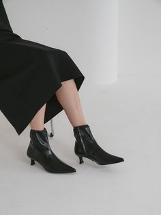 Editor's NoteOI PAINTED's shoe will add elegance to your daily outlook- Modern soft pointed toe - Soft and subtle gloss leather texture- Set on a stacked heel- Basic silhouette with feminine mood- Daily point itemMeasurements (in.)- Heel: 2.0in.- Size: US 5.5(KR225mm) - US 8 (KR250mm)- This item is based on the KR shoe size. Please refer to the size chart.Composition & Care- Upper: Sheepskin- Lining: Synthetic leather- Outsole: Rubber- Professional leather care onlyDesigner- by OI PAINT Pointed Toe Boots With Sculpted Heel For Work, Workwear Boots With Sculpted Heel And Pointed Toe, Workwear Heeled Boots With Pointed Toe, Pointed Toe Heeled Boots With Padded Heel, Heeled Boots With Sculpted Heel And Pointed Toe, Office Boots With Stacked Pointed Heel, Sleek Ankle-high Heels With Sculpted Heel, Pointed Toe Boots With Sculpted Heel, Evening Pointed Toe Heeled Boots With Deep Heel Cup