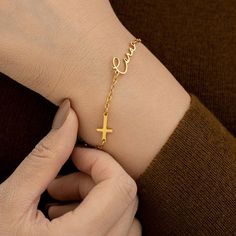 Our Custom Cross Name Bracelet in 18K Gold is a perfect way to add a personal touch to your style. This Necklace is a timeless and iconic addition to any jewelry collection. Whether for yourself or as a meaningful gift for someone special, it's a piece that truly speaks volumes. ◗ Bracelet length: Total Length: 6"+2" (Adjustable Length) ◗ Material: Made of high quality stainless steel with 18K Gold Plated handcrafted necklace ◗Chain Style: Cable Chain ◗Pendant Size: Varies depending on the perso Elegant Personalized Cross Bracelets, Gold Cross Bracelets For Gifts, Personalized Gold Rosary Bracelet As Gift, Yellow Gold Cross Bracelet For Gift, Yellow Gold Cross Bracelets As Gift, Yellow Gold Cross Bracelet Gift, Yellow Gold Cross Bracelet As Gift, Gold Cross Bracelet For Baptism, Elegant Personalized Rosary Bracelet As Gift