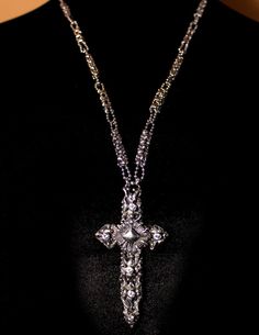 This is a stunning SG Liquid Metal unisex microchip skeleton cross by Sergio Gutierrez embellished with handmade roots and SG signature brush silver soldering technique. One of a kind Necklace. The cross comes on a delicate famous handcrafted “CH1” Chain link made completely of ball chain and enhanced with brilliant cut zircons. Sergio Gutierrez was granted a patent # US 6,536,112B1 as the inventor of the process for making jewelry incorporating a microchip. Allow 3 working days for the orders t Unique Adjustable Cross Jewelry, Adjustable Unique Cross Jewelry, Unique Silver Jewelry With Sparkling Details, Luxury Silver Crucifix Necklace, Silver Symbolic Crucifix Jewelry, Unique Silver Cross Pendant Necklace, Unique Silver Necklace With Cross Pendant, Luxury Silver Cross Jewelry, Adjustable Silver Cross Pendant Jewelry