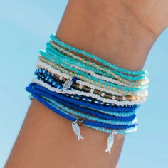 Get the Blue Sky, Turquoise Sand, Treasure Cove and Cobalt all together in this stack! Don't just style with one wrap, stack with your favorite pieces. Our stacks can be worn as a bracelet, necklace, or anklet. Eye-catching and available in multiple variations, these wraparounds are sure to complement your easy beach style. Multicolor Stacked Bracelets For Beach, Beach Multicolor Stackable Bracelets, Ocean-inspired Turquoise Bracelet For Summer, Ocean-inspired Multicolor Bracelets For Beach, Adjustable Ocean-colored Bracelets For The Beach, Inspirational Bracelets, Just Style, Hand Of Cards, Women Artisans