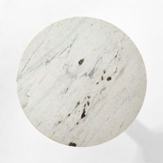 a round marble table top on a white background