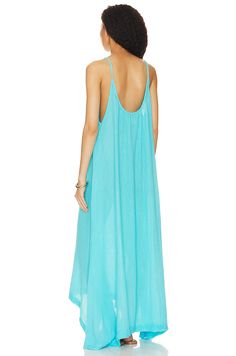 Beautiful maxi dress in an aqua color blue! Could fit small and medium because it has a stretch and is super flowy! 100% cotton Made in USA Hand wash Unlined Pull-on styling Crinkle gauze fabric Airy Flowy Dress For Beach Cover-up, Light Blue Maxi Dress For Beach Cover-up, Turquoise Maxi Dress For Beach Cover-up, Light Blue Maxi Dress For Summer Beach, Chic Light Blue Maxi Dress For Beach, Light Blue Maxi Dress For Summer Beach Cover-up, Flowy Breezy Dress For Poolside, Light Blue Maxi Dress For Beach Cover-up In Spring, Blue Maxi Dress For Spring Poolside