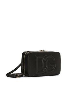 Embossed-logo cross-body bag from DOLCE & GABBANA featuring black, calf leather, embossed logo to the front, adjustable detachable shoulder strap, top zip fastening, gold-tone hardware, main compartment, internal zip pocket and slip pocket to the rear. This item is in size UNI and the color is Black Logo Camera, Dg Logo, Leather Camera Bag, Latest Bags, Gucci Soho Disco Crossbody, Bottega Veneta Shoulder Bag, Louis Vuitton Shoulder Bag, Strap Top, Strap Tops