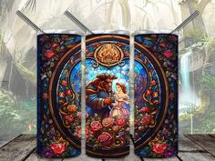 the beauty and the beast stained glass artwork is on display in front of a wooden floor