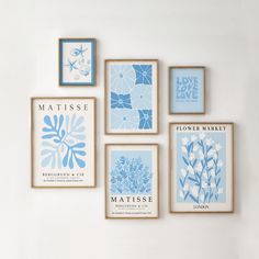 six blue and white flower prints hanging on the wall