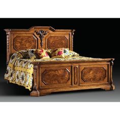 a wooden bed with ornate carvings on the headboard and foot board, made in america