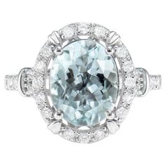 an aqua blue and white diamond ring