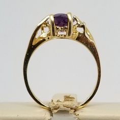 "We do not check prongs for wear or stones for looseness. All items are sold as is-noting that we are a resale shop so everything here had a previous owner! We will include flaws in the description when noted. This is one of the reasons our items are more affordable than new at a jewelry store. Vintage 10K Yellow Gold Ring with Amethyst & Diamonds, Size 5.75. Stamped 10KP inside band. Weighs 1.5 dwt. Please stop in often as we will be adding additional vintage fine jewelry beauties. Note tha Vintage 14k Gold Amethyst Ring With Accent Stones, Gold Amethyst Ring Stamped 14k, Gold Amethyst Ring With Accent Stones, Round Cut, Gold Amethyst Ring With Accent Stones For Anniversary, Gold Amethyst Ring With Accent Stones, Gold Heirloom Amethyst Birthstone Ring, Gold Amethyst Birthstone Ring With Accent Stones, Heirloom Gold Birthstone Ring With Amethyst, Formal Gold Amethyst Ring With Birthstone