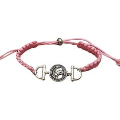 a pink rope bracelet with a silver clasp and an emblem on the clasp is shown in front of a white background