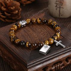 Expertly crafted, this Knights Templar Commandery Bracelet combines the elegance of silver with the healing properties of brown onyx gemstones. Incorporating the legendary symbol of the Knights Templar, this bracelet is a timeless piece that exudes power and protection. Perfect for those seeking both style and strength.We ship worldwide to 185 countries! Please allow 1-2 business weeks for your order to arrive. Onyx Gemstone, Silver Cross, Healing Properties, Knights, Silver Bracelets, Timeless Pieces, Onyx, Healing, Bracelet