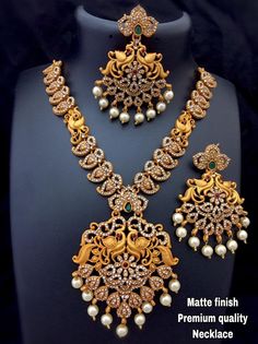 Traditional Matte Gold Bridal Jewellery South Indian Temple Jewelry Necklace With Earrings Set Gold Plated Handmade Indian Jewelry for women Materials: alloy Plating: Gold plated Stone type: Artificial Stone Style: Boho & hippie Please contact us for Bulk Orders. Occasions: Wedding Wear, Party Wear, Festive Wear, Durga Puja, Indian Wear, Sangeet Wear, Bridal Wear, Chrismas Day, Mothers Day, Haldi Wear. NOTE *Actual color may vary slightly from your monitor. *We dispatch the product within 5 South Indian Necklace, Gold Bridal Jewellery, Jewellery South Indian, Necklace With Earrings Set, Haldi Wear, South Indian Temple, Traditional Wedding Jewellery, Beautiful Temple, Temple Jewelry Necklace