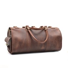 The Weekender Duffle is now available in dark brown and tobacco vintage cowhide leather. This leather has a more rustic finish than our standard veg-tan leather Weekenders. Ready to escape for a few days? Whether it's a weekend road trip or an overseas flight, the Marlondo Leather Weekender Duffle Bag helps you travel in comfort and style. It's easy to pack, easy to carry, and will only look more beautiful with time and use. Its single, spacious compartment will readily house all your travel gea