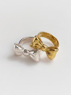 Unique and elegant accessories that will embellish your outfit - Sizable ribbon shape ring- 18K gold plated- Logo carved inside- Additional charges apply for the gold color option Luxury Bow Jewelry For Anniversary, Gold Bow Rings For Wedding, Gold Rings With Bow For Formal Occasion, Gold Bow Ring For Anniversary, Trendy Gold Jewelry With Bow, Formal Gold Rings With Bow Detail, Luxury Silver Jewelry With Bow, Chic Yellow Gold Jewelry With Bow Detail, Luxury Silver Jewelry With Bow Detail