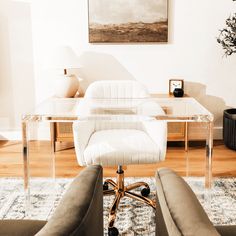 a living room with a glass table and chairs