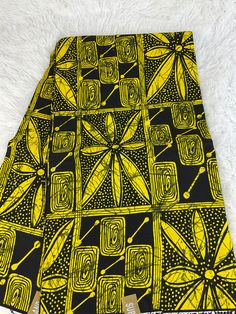 This yellow and Black African Fabric is high quality African print made from 100% cotton and it's 45 inches wide. It is used for making African Clothing, African quilts, & For Home decoration. FYI: Print is Double sided. The listing is for 1, 6 yards and Headwrap Each piece of fabric measures:  36in by 45in for 1 yard 216in by 45in for 6 yards 70in by 22in for Head wrap If you purchase more than one yard, you will receive one continuous piece. *If you require more than what I have listed, feel free to send me email. CARE INSTRUCTIONS: *DO NOT BLEACH *Hand wash with cold water and mild soap or Dry clean *Press with hot iron for a crispy look. Color may be different due to your monitor African Headwrap, African Quilts, Clean And Press, African Textile, Shoe Making, African Prints, African Print Fabric, Ankara Fabric, Fabric Bundle