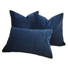 two blue velvet pillows on white background