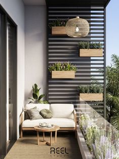 a balcony with potted plants on the wall and a couch in the foreground