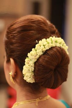 a woman with flowers in her hair