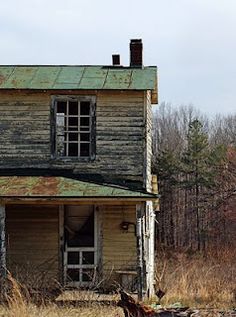 an old run down house in the woods