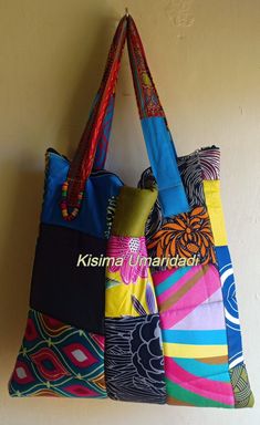 This bag is made by patching together different pieces of colorful of Kitenge fabric. The uniqueness in this bag is that none looks like the other. Inside the bag is not partitioned. Its light in weight and easy to clean. Machine and hand washable. Kitenge Fabric, African Quilts, Kitenge, Clean Machine, Feb 8, Denim Bag, Reusable Bags, Handmade Art, African Print