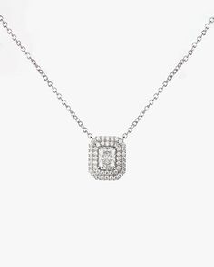 - Princess cut gemstone with Surrounding round cut stones Necklace- Made in Sterling silver set with a high-quality Cubic Zirconia. - Stone size: Princess cut 5.00 x 7.00 mm, Round cut 1.10 mm- Size : 12 x 14 mm ( 0.47 x 0.55 inch )- Chain length : 16 inch Sterling silver925 Sterling Silver is an alloy made of 92.5% pure silver and 7.5% copper. We plate our silver jewelry in rhodium, which gives it extra shine and durability. Rhodium is one of the costliest precious metals due to its rarity.Care Classic Silver Jewelry With Lab Grown Diamonds, Classic Silver Jewelry With Lab-grown Diamonds, Elegant Oval Pendant Jewelry With Single Cut Diamonds, Elegant Jewelry With Single Cut Diamonds In Oval Pendant, Formal Silver Diamond Cut Diamond Necklace, Formal Silver Diamond Cut Necklace, Formal Silver Diamond Chain Necklace, Exquisite Silver Diamond Cut Diamond Necklace, Silver Oval Moissanite Necklaces