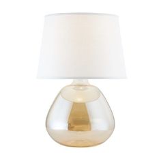 a clear glass lamp with a white shade