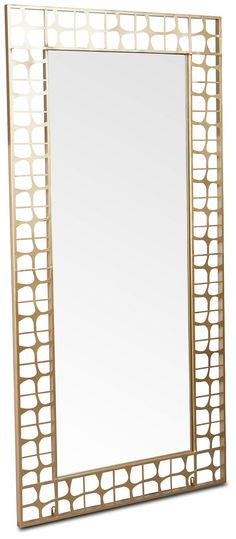 a gold framed mirror sitting on top of a table