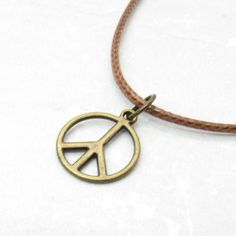 Peace Sign Necklace, Peace Symbol Pendant, Peace Pendant Necklace, Hippie Necklace, Boho Necklace, Necklace for Men, Men's Necklace, Woman's Necklace, Peace Sign Jewelry, Peace Sign, Peace NECKLACE STYLE AND LENGTH: Please select the style and length of necklace from the drop down lists. Antique Bronze Tone Alloy Chains: Flat Link, Twist Curb and Ball Chain and includes a lobster clasp closure or ball connector for Ball Chain. Waxen Cotton Cord: Strong alternative to leather but soft and smooth Vintage Jewelry With Peace Sign As Gift, Vintage Jewelry With Peace Sign For Gift, Vintage Peace Sign Jewelry Gift, Adjustable Peace Sign Necklace, Adjustable Peace Sign Necklace As Gift, Peace Sign Jewelry, Peace Jewelry, Peace Necklace, Peace Sign Necklace