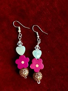 * Currently available colors is magenta!*  You're a lantern in the night baby! Show your love for Greta Van Fleet with these earrings! Based off the song Flower Power Message me if you would like a different color flower or a peace sign or a heart! Made with nickle free ear wires , metal beads, shell beads, glass beads, and wooden beads Greta Can Fleet Jewelry, Greta Van Fleet, Aesthetic Gift, Hippie Flowers, Boho Aesthetic, Color Flower, Boho Gifts, Inspired Jewelry, Shell Beads