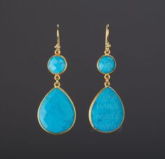 A pair of two tier natural turquoise stones set in gold vermail (gold lated over sterling silver) bezel:1. Stone : Turquoise (natural gemstone)2. Stone shape and size:        top: round 11 mm across       bottom: pear 26 x 21 mm3. earring total length ~60 mm4. bezel material: gold vermail (gold over sterling silver)5. earring hook: gold vermail 6. an optional custom note card, printed with your personalized message on heavy weight cardstock, in elegant font and layout.Earrings in other colors ar Long Turquoise Earrings, Earring Long, Turquoise Earring, Engraved Locket, Earrings Dangle Simple, Natural Turquoise Stone, Chalcedony Earrings, Sterling Silver Locket, Turquoise Earrings Dangle