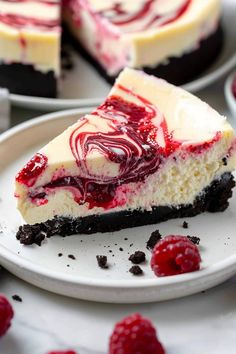 a slice of cheesecake with raspberry topping on a plate