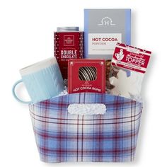 a basket filled with coffee, hot chocolate and other items