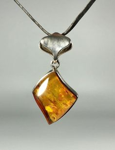 Valentines Day Perfect Gift!Elevate your jewelry collection with our stunning Genuine Amber Pendant, featuring a spectacular color and weighing 9,1 grams, set in high-quality 925 Sterling Silver. This exquisite pendant is designed especially for women who appreciate unique, handcrafted jewelry that combines elegance with the natural beauty of amber. Key Features: Authentic Baltic Amber: Our pendant showcases genuine Baltic amber, renowned for its stunning and unique color, adding a touch of natu Fine Jewelry Amber With Polished Finish, Luxury Amber Necklace With Polished Finish, Amber Necklace Hallmarked For Anniversary, Amber Hallmarked Necklace For Anniversary, Formal Polished Sterling Silver Gemstones, Formal Sterling Silver Gemstones With Polished Finish, Classic Sterling Silver Pendant Gemstone, Orange Sterling Silver Fine Jewelry, Classic Sterling Silver Gemstone Pendant