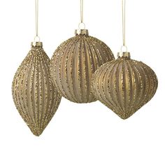 three gold christmas ornaments hanging from chains