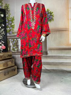 Embrace the vibrant cultural heritage of Sindh with this exquisite kurta salwar set. This kurta and salwar is adorned with intricate tilla embroidery, showcasing delicate gold threads that form traditional motifs. Complementing the tilla work are sparkling mirror embellishments, adding a touch of glamour and shimmer to the ensemble. The dress, crafted from soft, comfortable cotton fabric, provides a perfect balance of tradition and modern elegance. Ideal for festive occasions and cultural celebr Traditional Palazzo Set With Printed Motifs For Wedding, Traditional Red Palazzo Set With Dabka, Bollywood Style Dabka Salwar Kameez For Navratri, Semi-stitched Traditional Wear With Printed Motifs For Eid, Red Salwar Kameez With Printed Motifs For Transitional Season, Designer Salwar Kameez With Printed Motifs For Transitional Season, Unstitched Cambric Traditional Wear For Festive Occasions, Jamawar Palazzo Set With Straight Kurta For Transitional Season, Transitional Jamawar Palazzo Set With Straight Kurta