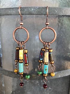 A stunning 3 inches long, hand crafted dangles with etched Czech Picasso tubes and beads in rich earthy colors. These are a Bohemian, earth mother statement! Hand wrapped wire accentuates the earthy beauty of copper findings.  Rustic and elegant. One of a kind. Hand crafted in the Wild Fire Studio in the Texas Hill country. Free domestic shipping. Earthy Beauty, Boho Drop Earrings, Copper Mountain, Earth Mother, Diy Jewelry Earrings, Wild Fire, Earthy Colors, Beads And Wire, Etsy Earrings Dangle