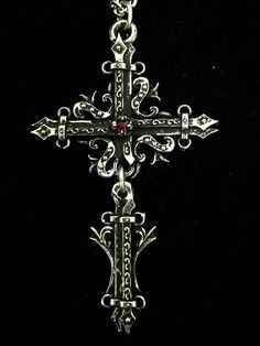 This Gothic Cross necklace is an handmade pewter sculpture orned with a gemstone of your choice :) This Gothic Cross Pendant is sold with a stainless steel chain This Gothic Cross is a pendant of 7.5cm  This Gothic Cross Necklace is a pewter sculpture of my own creation, i create and work the metal by myself at home. The material used is the finest and highest grade hypoallergenic pewter alloy of 98%tin Wholesale is available for stores, if you are interested please contact me about that :) Than Gothic Metal Cross Pendant Jewelry, Gothic Cross Pendant Jewelry, Gothic Cross Jewelry As Gift, Gothic Cross Jewelry Gift, Gothic Cross Jewelry For Gifts, Gothic Cross Pendant Jewelry Gift, Medieval Engraved Cross Pendant Jewelry, Medieval Silver Cross Pendant Jewelry, Gothic Cross Necklace With Oxidized Finish