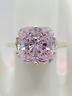 Pink Diamond Rings With Diamond Cut, Pink Moissanite Diamond Ring As Gift, Dazzling Pink Emerald Cut Ring, Pink Diamond Ring With Vvs Clarity For Wedding, Pink Diamond Ring With Diamond Accents For Wedding, Luxury Pink Cubic Zirconia Wedding Jewelry, Pink Diamond Ring With Accents For Wedding, Pink Diamond Cut Diamond Ring, Pink Moissanite Diamond Ring For Anniversary