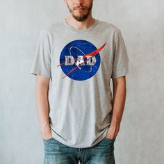 NASA Dad Shirt, NASA Family Shirts, NASA Personalized Shirts, Customized T-shirts We use DTG (direct to garment digital) printing method! It's not vynil. DTG printing technique involves jetting or spraying special aqueous inks from print heads directly onto the surface of textiles, which allows the fabric stay soft and breathing! The Adult shirts are Unisex. We use Bella Canvas and Gildan Softstyle brands. The shirts are made from very soft material Solid colors are 100% cotton, Heathered colors Casual Sublimation Print T-shirt For Father's Day, Casual T-shirt With Sublimation Print For Father's Day, Blue Tops With Screen Print For Father's Day, Blue Screen Print Tops For Father's Day, Father's Day Cotton T-shirt With Graphic Print, Father's Day Graphic Print Short Sleeve Tops, Blue Relaxed Fit T-shirt For Father's Day, Father's Day Graphic Print Short Sleeve T-shirt, Relaxed Fit Short Sleeve Printed Shirt