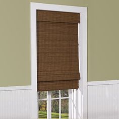 a window with a brown roman blind in it