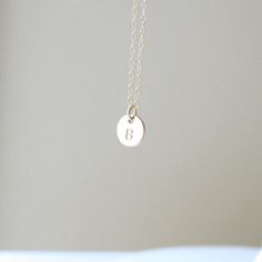 A dainty little 14k Gold Filled initial disc is hand stamped with your choice of initial in uppercase block font. The disc measures 8mm (1/4").  The initial disc comes on a delicate, but very strong, 14k Gold Filled chain.Beautifully packaged in our signature white and gold Eden Zoe gift box. Block Font, Gold Filled Chain, Initial Necklace, Hand Stamped, Belly Button Rings, Eden, Gold Filled, New Zealand, Initials