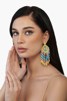 Every winter and Spring'22 runway has focused on this particular trend- The drop earrings! One of the most universally flattering ways to accessorize, we are loving the Neon Lights Earrings this season. Hand beaded with vibrant shades of green, turquoise and coral. They will make every outfit come alive dancing to your every move. Hand crafted by skilled artisans from India, they feature bead fringes detail. Style it with happy dresses and easy outfits alike to go from day to night. Beautiful Ni Trendy Multicolor Festive Jewelry, Festive Multicolor Trendy Jewelry, Turquoise Tassel Drop Earrings For Summer, Turquoise Tassel Earrings For Beach, Summer Turquoise Tassel Drop Earrings, Beaded Multicolor Chandelier Earrings, Multicolor Beaded Chandelier Earrings, Trendy Beaded Chandelier Earrings, Colorful Vibrant Drop Earrings